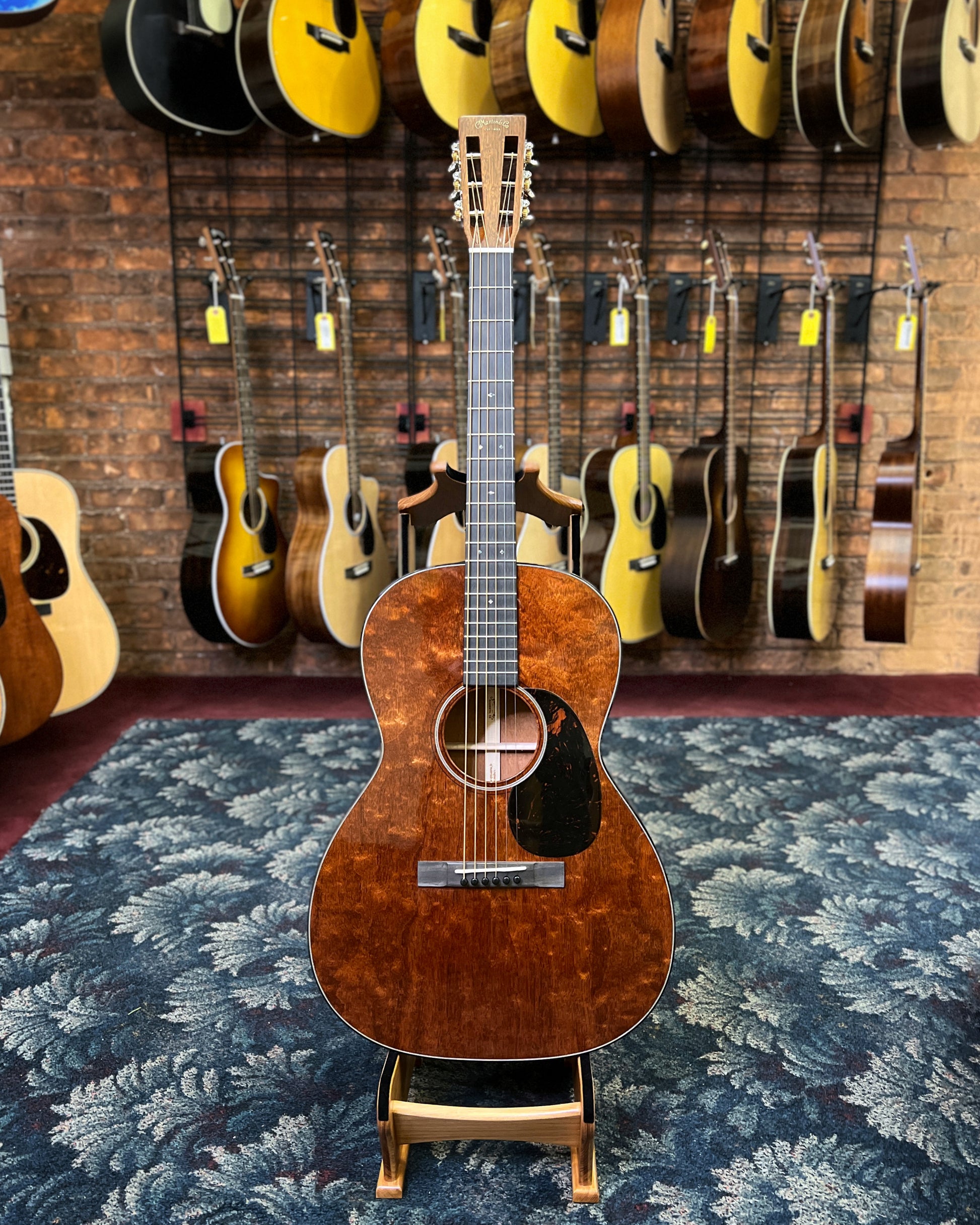 Showroom photo of Martin Custom 000 12-Fret Guitar & Case, All Quilted Mahogany, #1 of 2