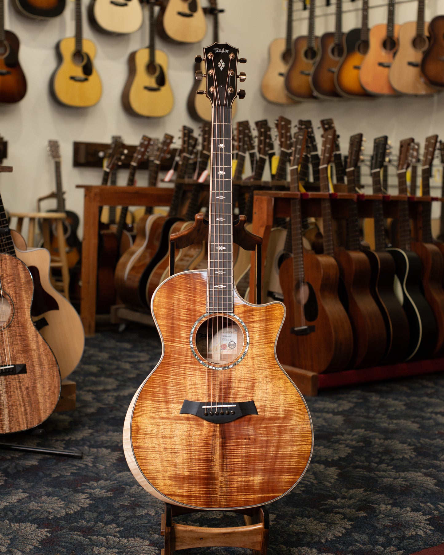 Showroom photo of Full front of Taylor Custom GA Koa Acoustic-Electric Guitar (2023)