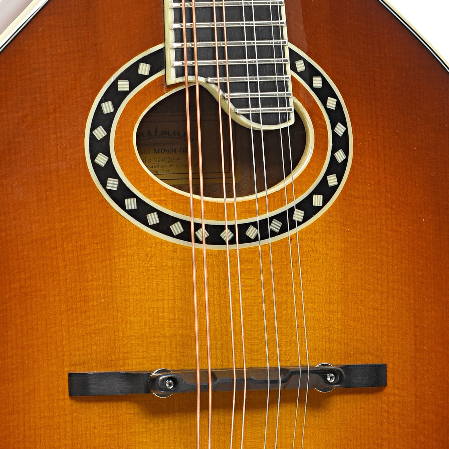 Bridge and sound hole of Eastman MD604 Mandolin
