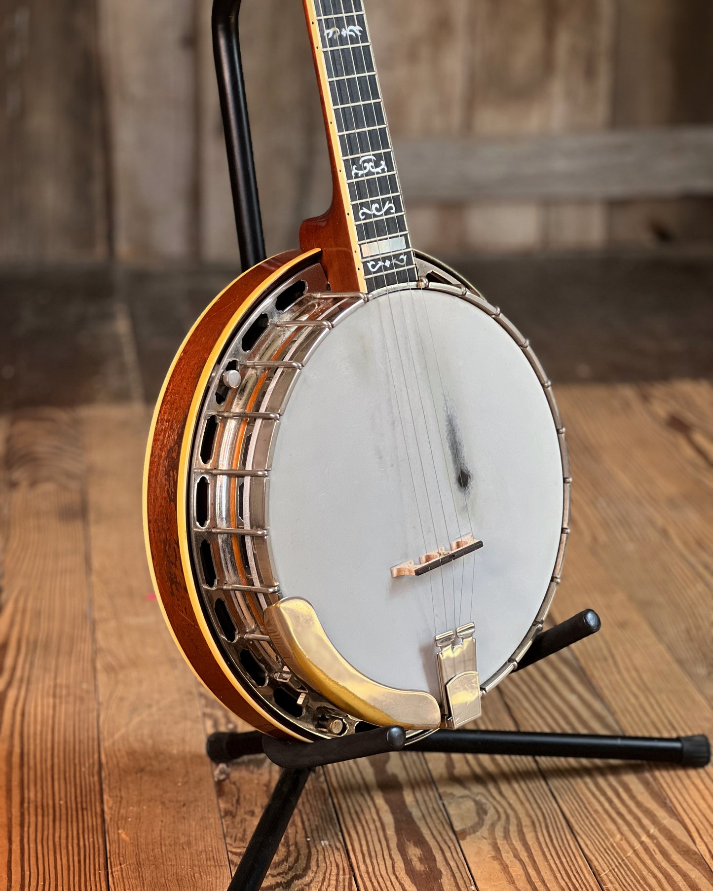 Showroom photo of Front and side of Gibson PB-3 Conversion Resonator Banjo (1930)