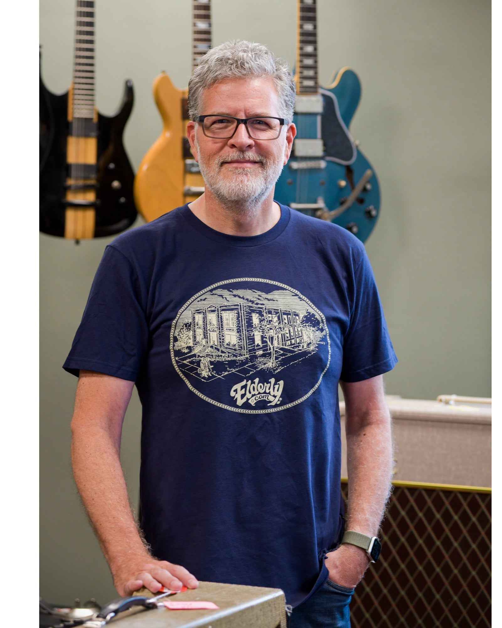 Todd wearing Elderly Instruments Building Shirt, Navy 