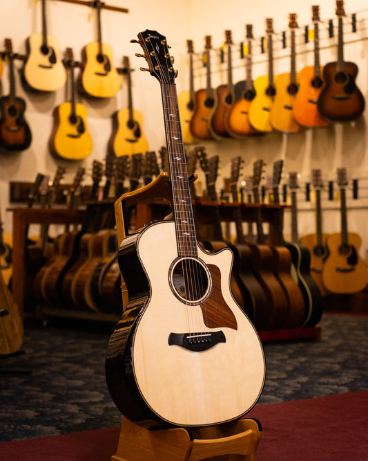 Showroom photo of Front and side of Taylor Builder's Edition 814ce