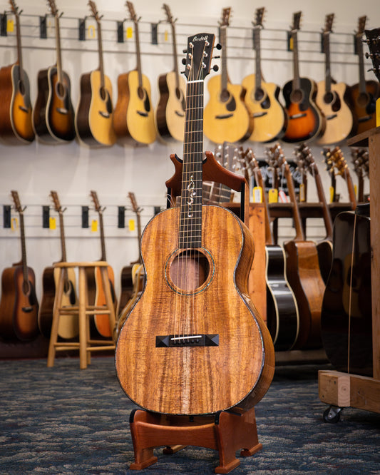 Showroom photo of Jake with Front of Bedell Limited Edition Fireside Parlor Koa