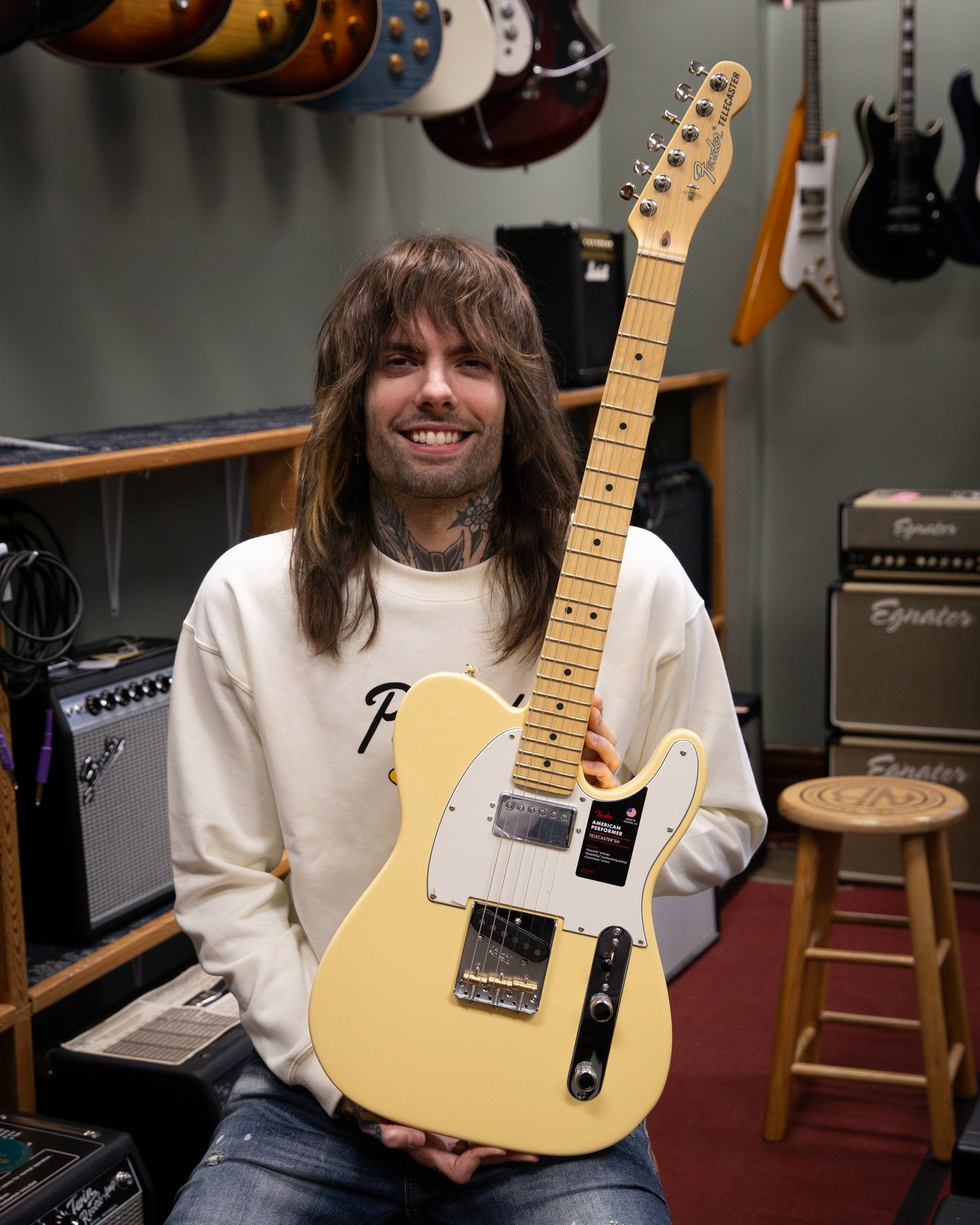 Showroom photo of full Front of Fender American Performer Telecaster Hum, Vintage White