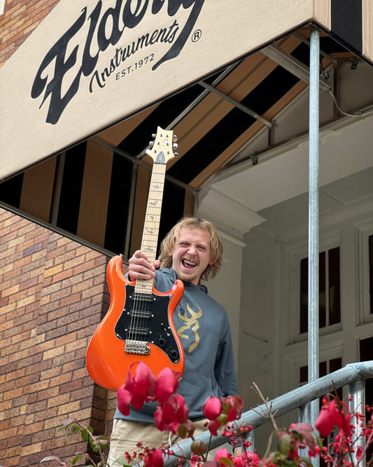 Showroom photo of Front of PRS SE NF3 Electric Guitar, Maple, Metallic Orange