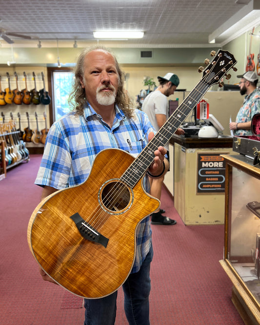 Showroom photo of Full front of Taylor Custom GA Koa Acoustic-Electric Guitar (2023)