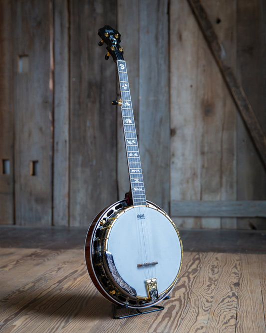 Showroom photo of Front and side of Capek Allegoria Gold Banjo, Flame Maple