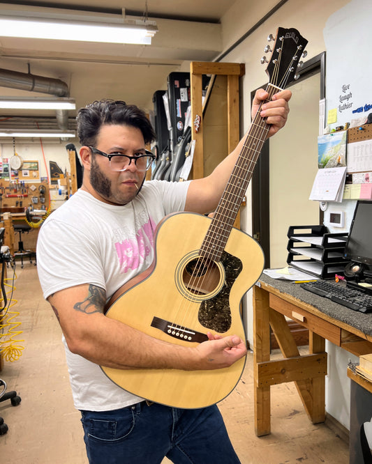 Showroom photo of Front of Guild 300 Series OM-340 Acoustic Guitar