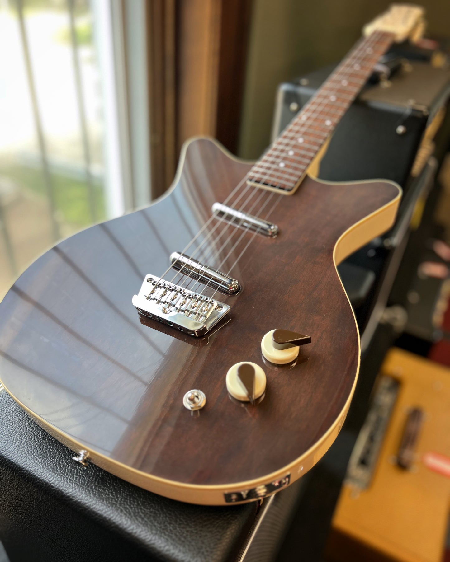 Showroom photo of Front of Danelectro '59 Divine, Dark Walnut