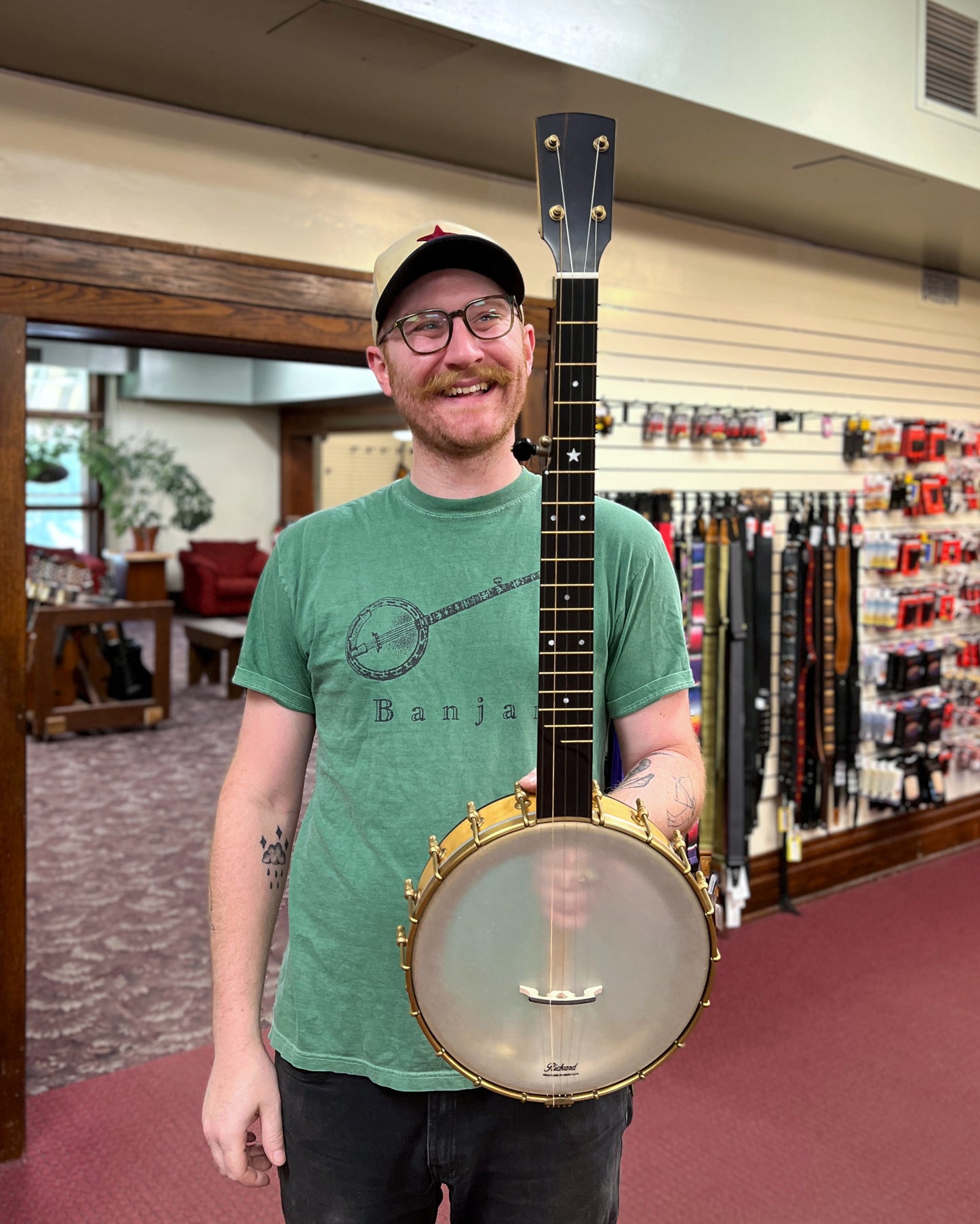 Showroom Photo of Front and Side of Rickard 11" Dobson Openback Banjo