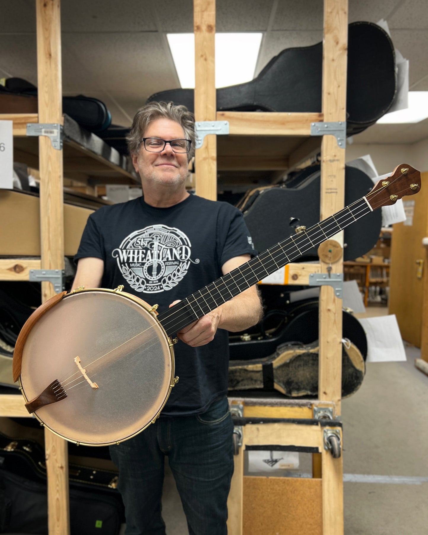 Showroom photo of Full front and side of C. Waldman 12" Chromatic (Step Side) Openback Banjo - No. 169