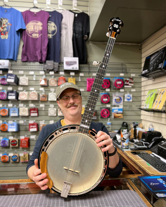 Showroom photo of Full front and side of Bishline Custom Zebrawood Resonator Banjo