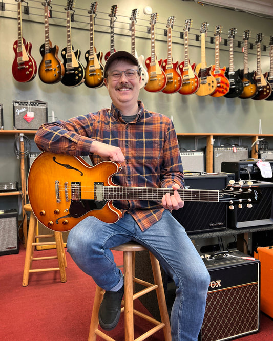 Showroom photo of Front of Collings I-35 LC Semi-Hollowbody Electric Guitar, Iced Tea Sunburst