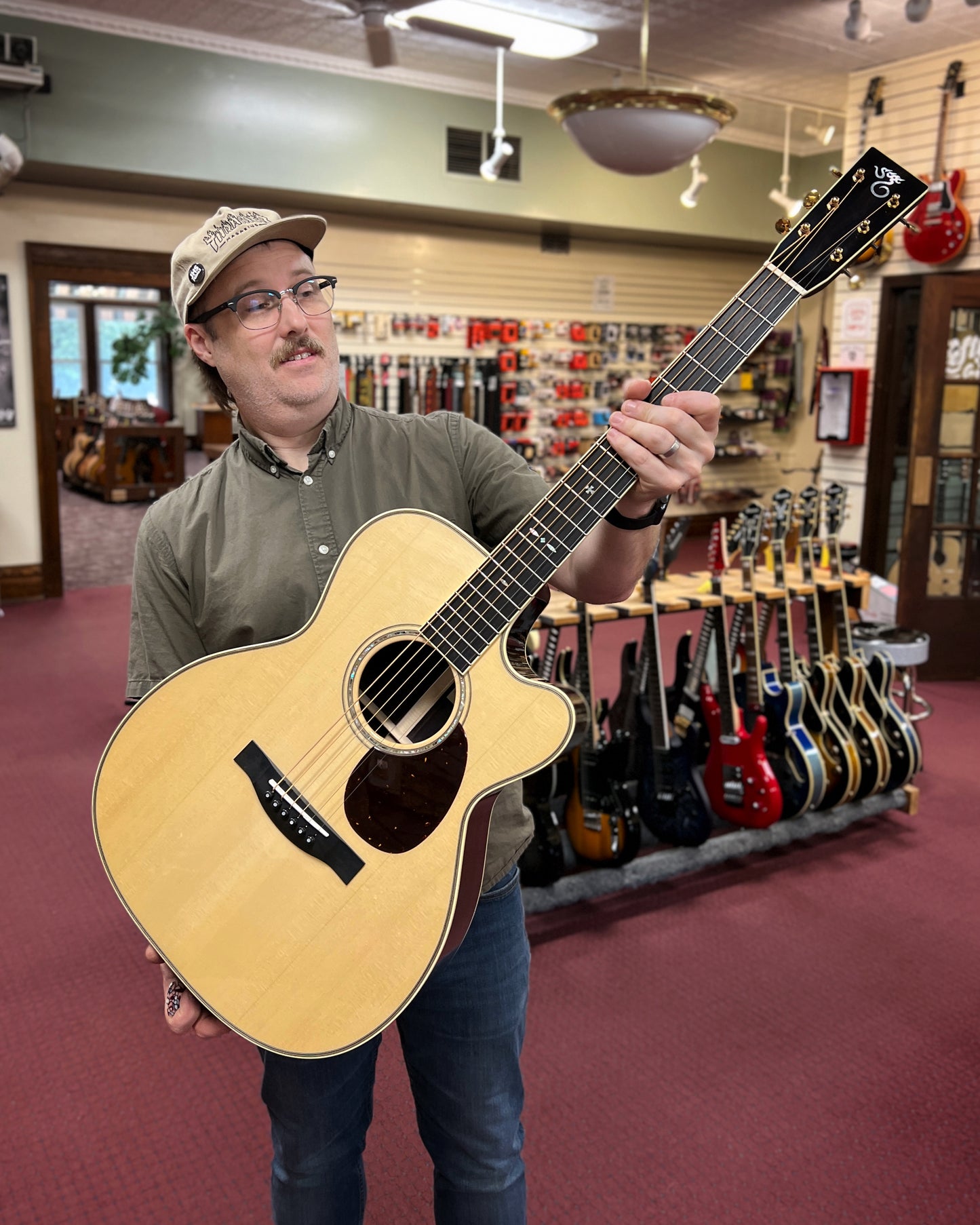 Showroom photo of full Front of Santa Cruz OM Custom Cutaway