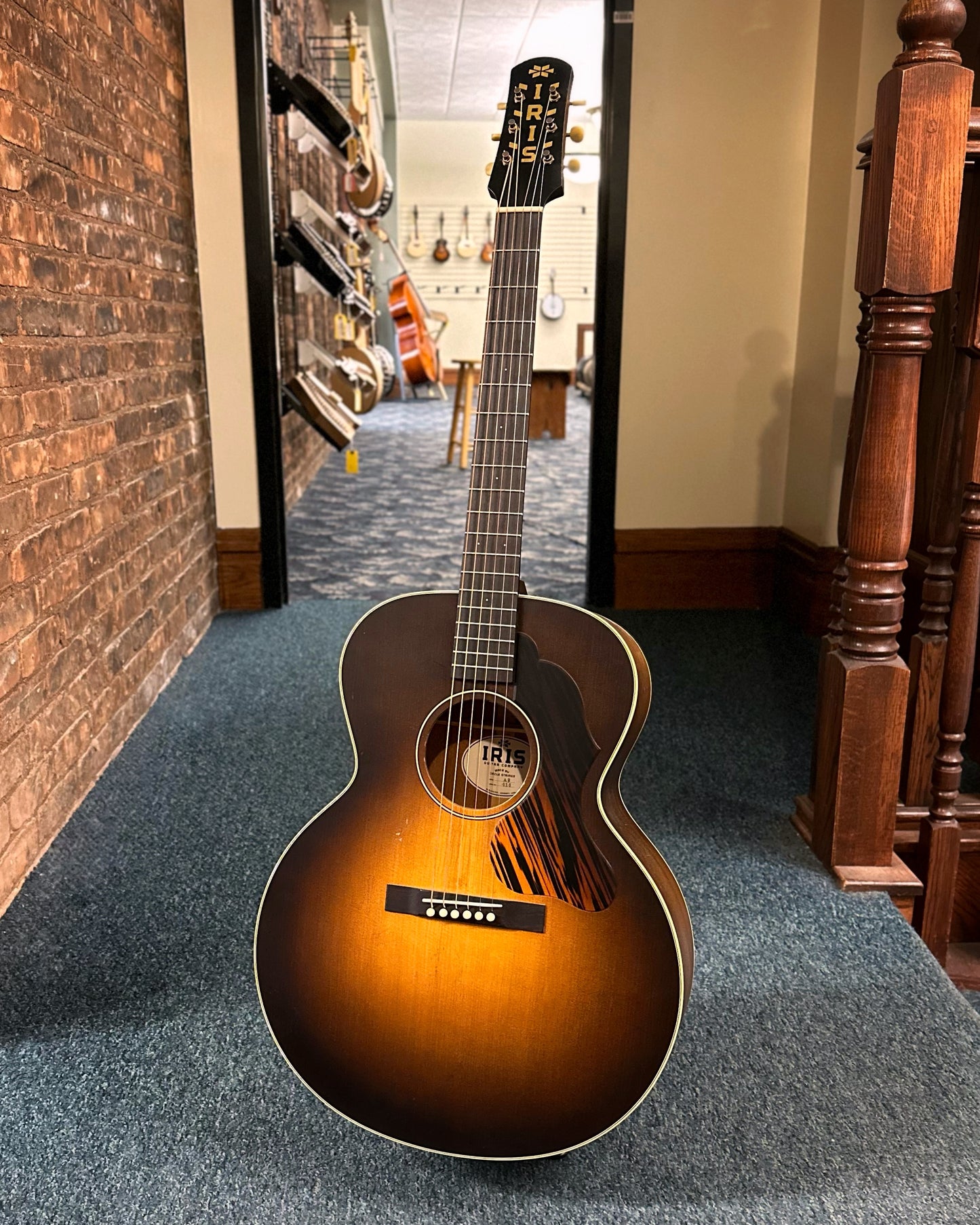 Showroom photo of Front of Iris Guitar Company AB Burst Relic Wide-Nut Small Jumbo Acoustic Guitar