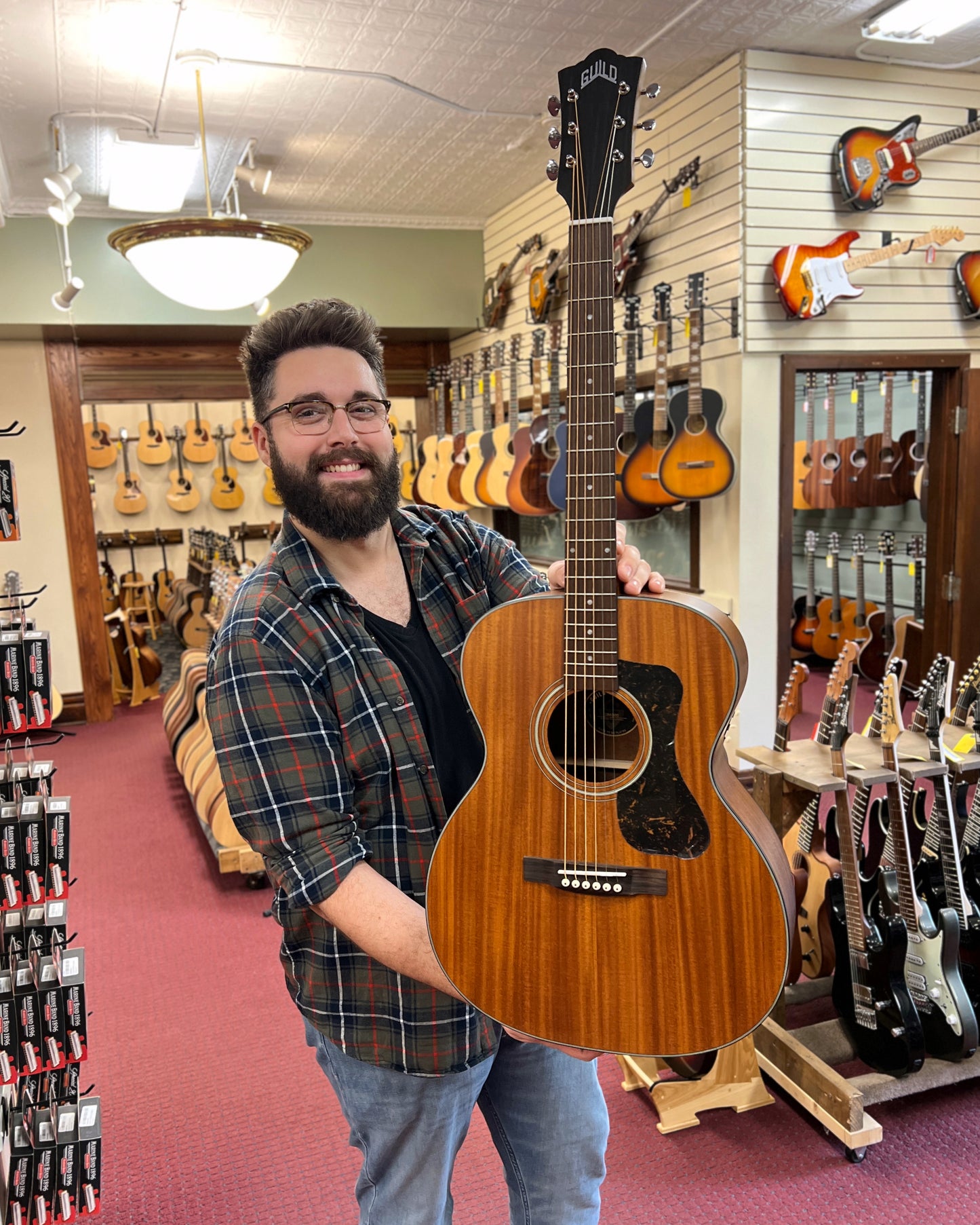 Showroom photo of Front of Guild 300 Series OM-320 Acoustic Guitar