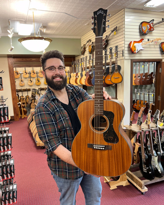 Showroom photo of Front of Guild 300 Series OM-320 Acoustic Guitar