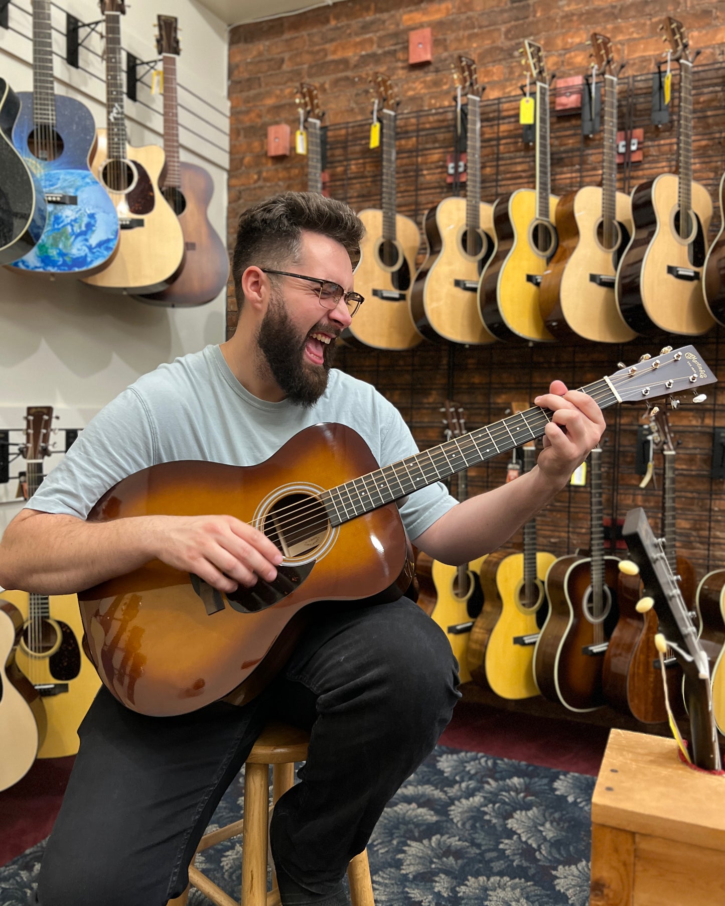 Showroom photo of Front of Martin OM-21 Ambertone Guitar & Case