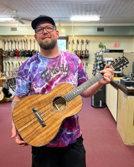 Showroom photo of Jake with Front of Bedell Limited Edition Fireside Parlor Koa