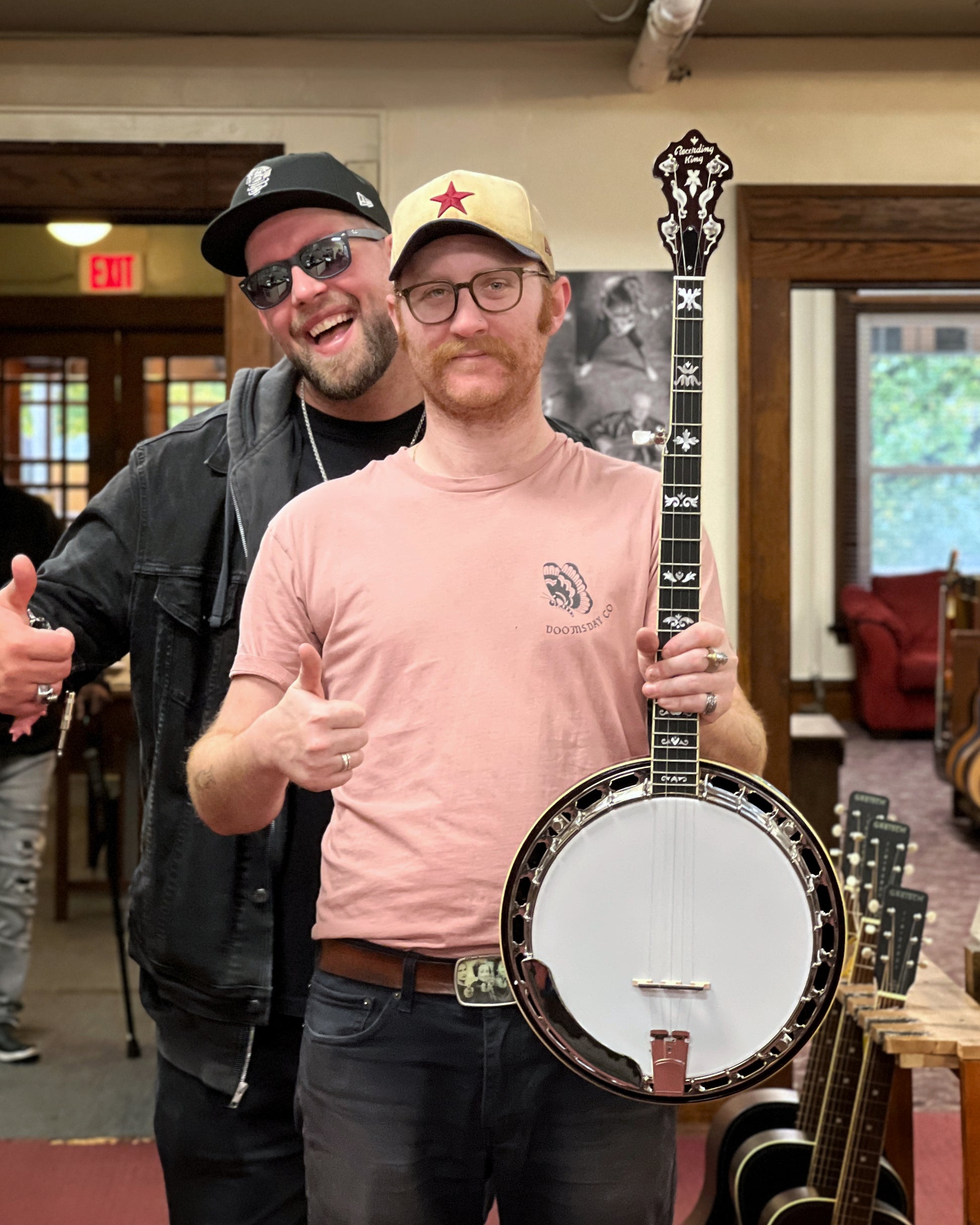 Showroom Photo of Front and side of Recording King Elite 75 Flying Eagle Resonator Banjo & Case