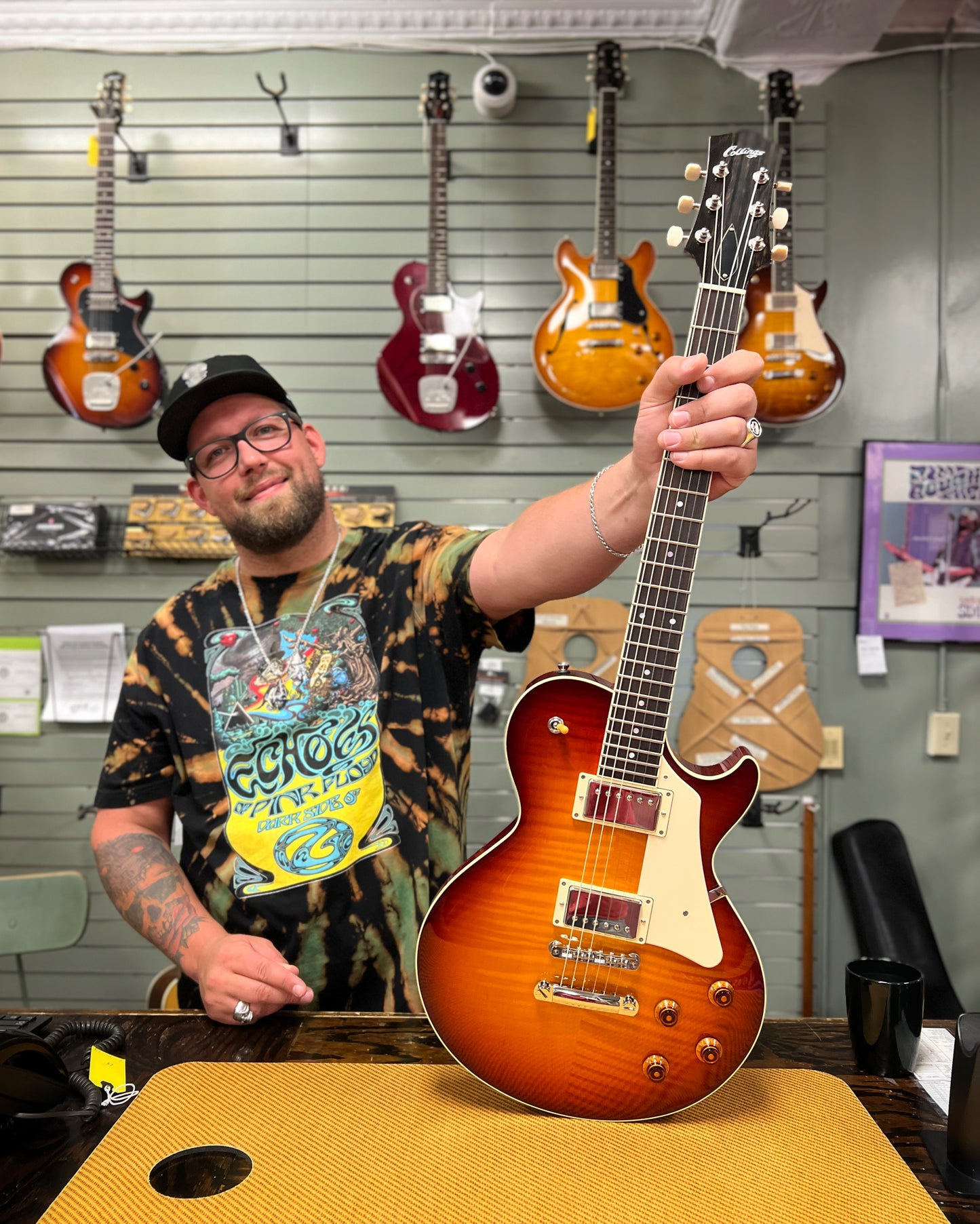 Showroom photo of full Front of Collings CL Electric Guitar, Dark Cherry Sunburst