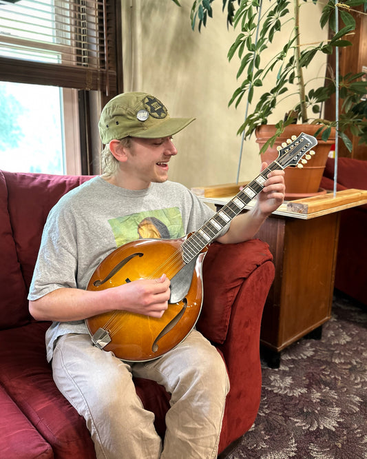 Showroom Photo of Front of Eastman MDO605 Goldburst Octave Mandolin 