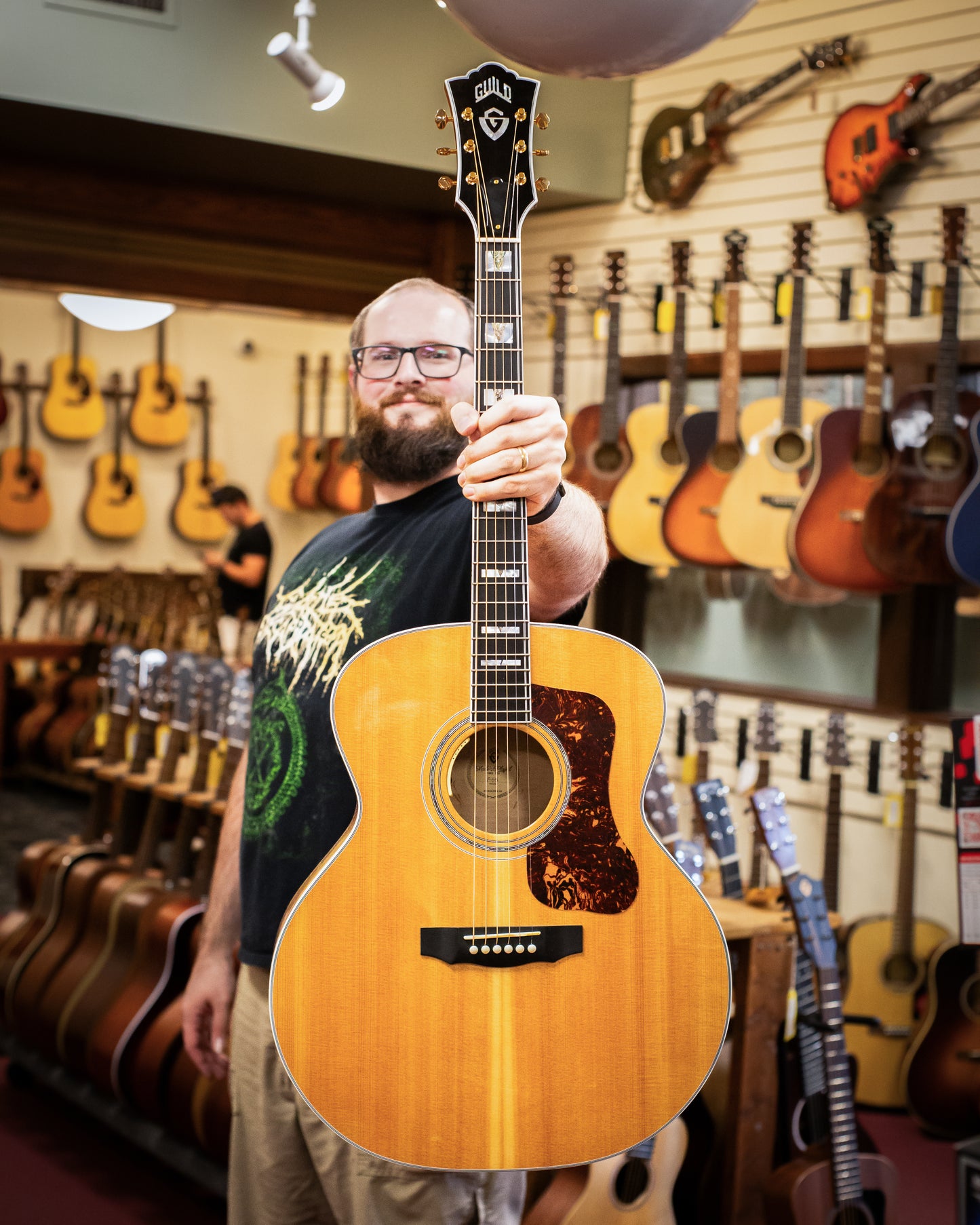 Showroom photo of Full front of Guild USA F-55E Maple Natural Acoustic Guitar