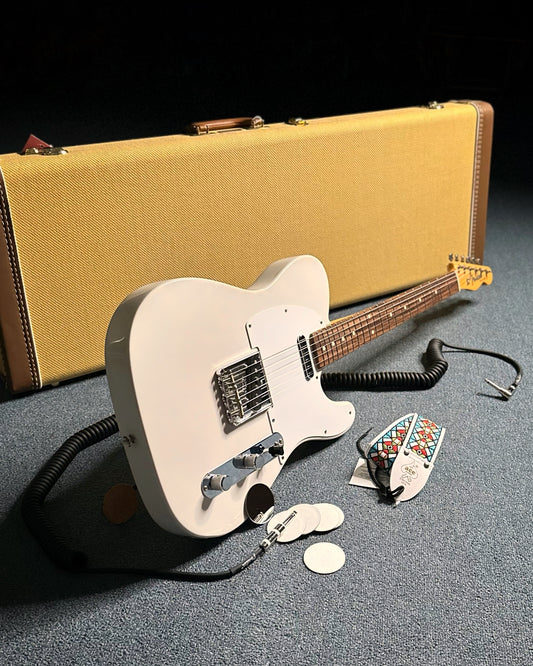 Showroom photo of Full front and side of Fender Jimmy Page Mirror Telecaster with case and accessories.