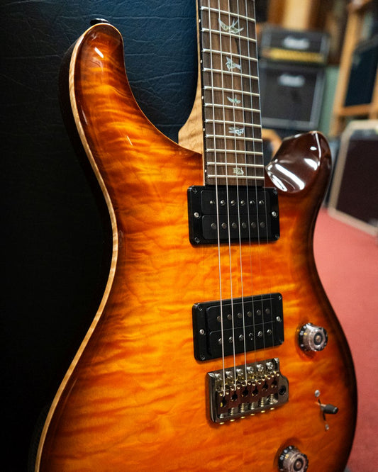 Showroom photo of Front of PRS Custom 24 Quilted Maple 10-Top Fatback Electric Guitar, Tobacco Burst