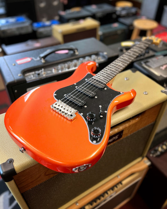 Showroom photo of Front of PRS SE NF3 Electric Guitar, Rosewood, Metallic Orange