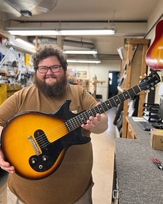 Showroom photo of full front Front of Gibson Melody Maker 3/4 Size Electric Guitar (1964)