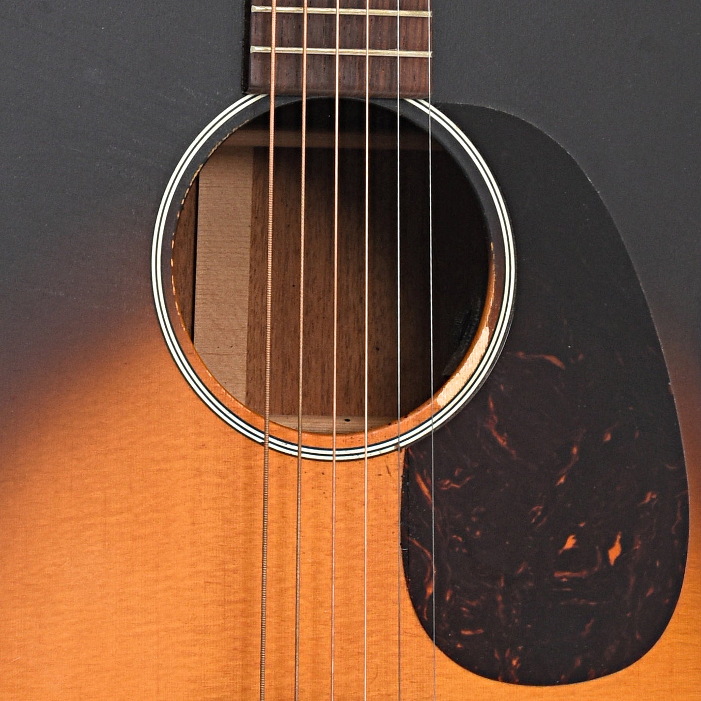 Sound hole and pickguard of Martin Custom 000-17e Whiskey Sunset 