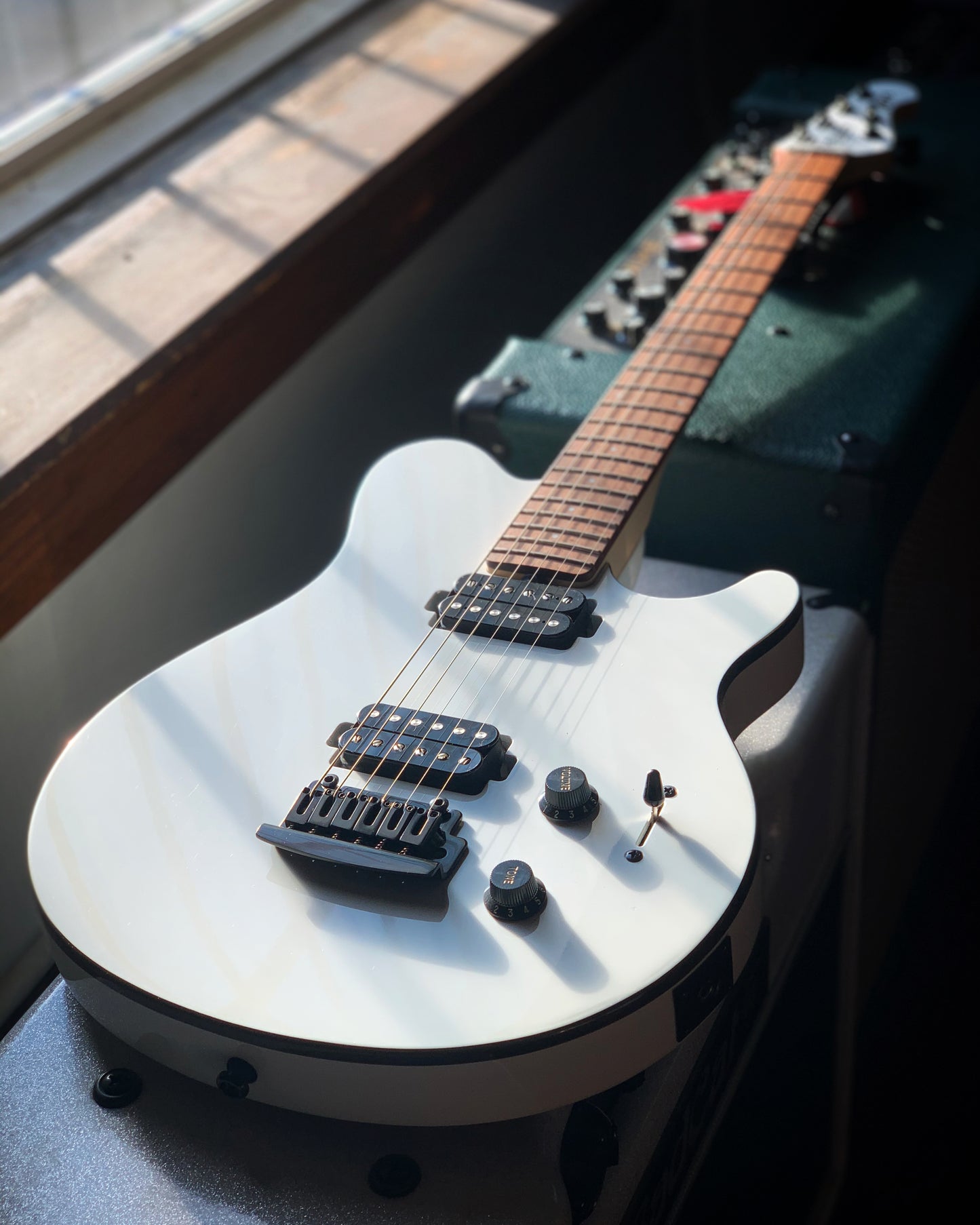 Showroom photo of Sterling by Music Man Axis Electric Guitar, White Finish