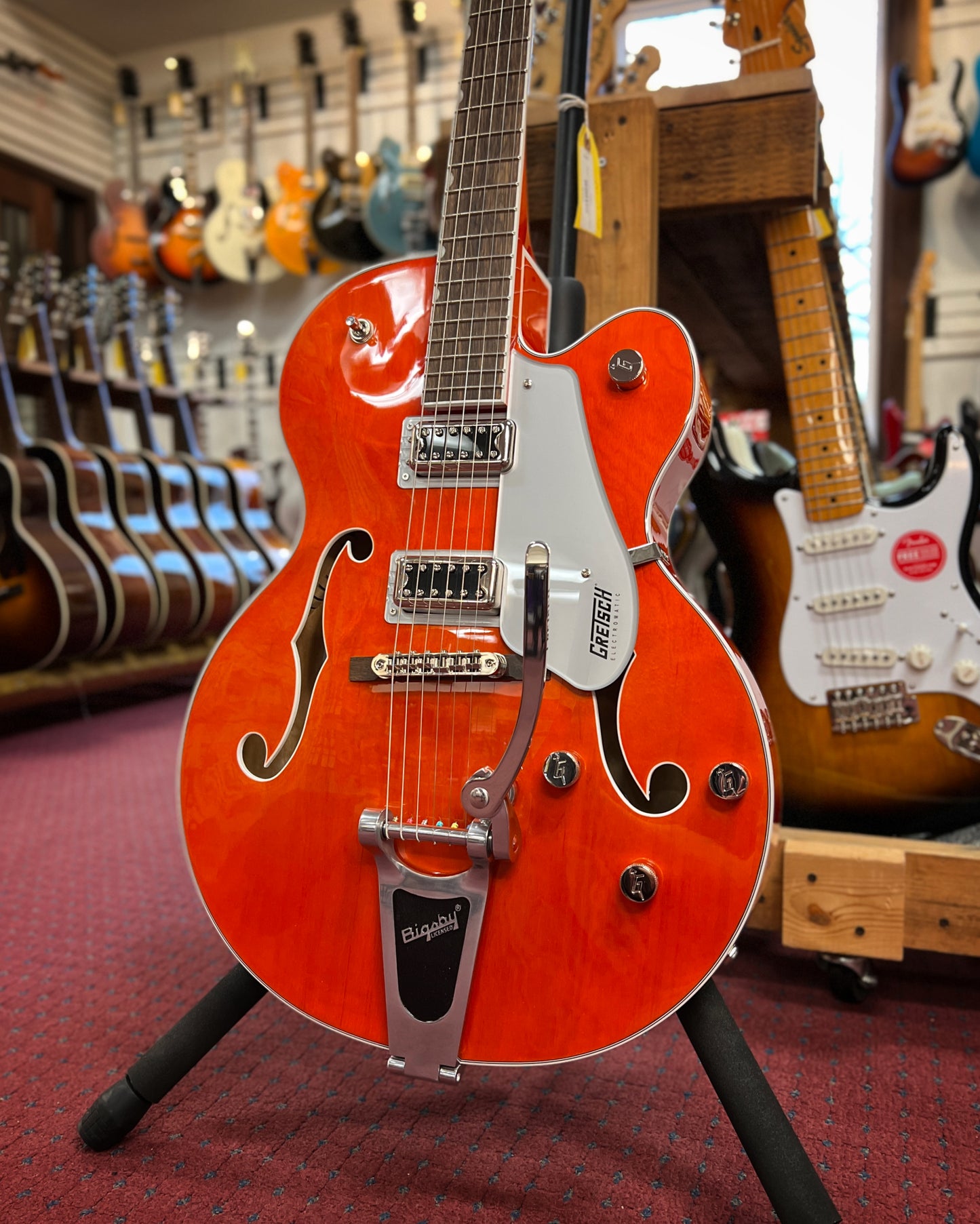 Showroom photo of Gretsch G5420T Electromatic Classic Hollow Body Single Cut with Bigbsy, Orange Stain